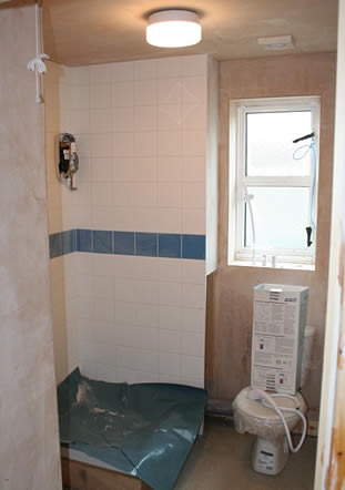Interior electrics, plumbing and decorating well underway.